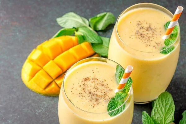 Mango lassi with mint leaves India 1006633264